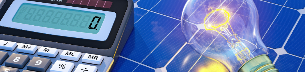 A solar panel, calculator, and light bulb on display.